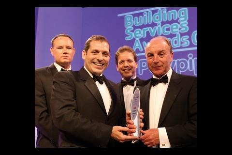 Representatives of consultancy of the year Beattie Flanigan accept their award, watched by EMC editor Andrew Brister (far left).